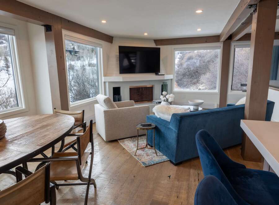 This stunning living space boasts a modern design with rustic accents, perfect for a cozy yet stylish home.