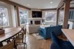 This stunning living space boasts a modern design with rustic accents, perfect for a cozy yet stylish home.