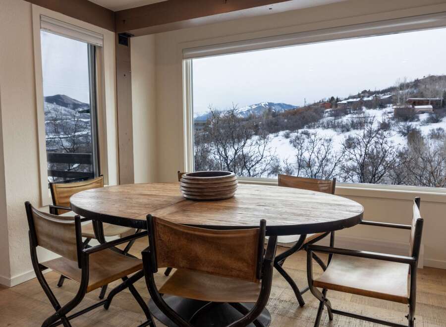 Enjoy breathtaking mountain views from this stunning dining room.