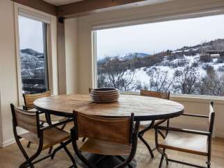 Enjoy breathtaking mountain views from this stunning dining room.