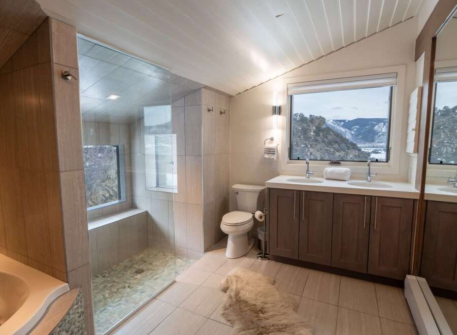This stunning bathroom boasts a modern design with high-end finishes.