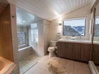 This stunning bathroom boasts a modern design with high-end finishes.