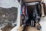 This cozy space features a well-organized closet, perfect for storing your wardrobe.
