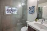 Step into a beautifully designed bathroom featuring a modern glass shower and stylish tile work.