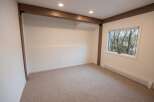 This inviting room features a neutral color palette, creating a versatile space ready for your personal touch.