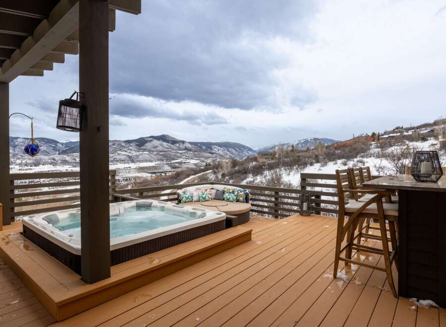 Enjoy breathtaking mountain views from this luxurious outdoor deck.