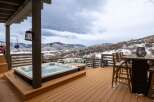 Enjoy breathtaking mountain views from this luxurious outdoor deck.