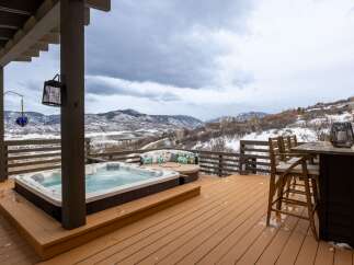 Enjoy breathtaking mountain views from this luxurious outdoor deck.