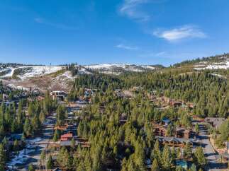 Nestled amidst a lush forest, this property offers a serene escape with stunning mountain views.