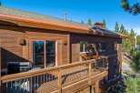 This stunning property boasts a beautiful wooden exterior and a spacious deck, perfect for enjoying the outdoors.
