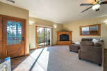 Step into this inviting living space, featuring a cozy fireplace and ample natural light.