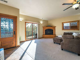 Step into this inviting living space, featuring a cozy fireplace and ample natural light.
