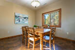 This inviting dining area features a beautiful wooden table and chairs, perfect for family gatherings.