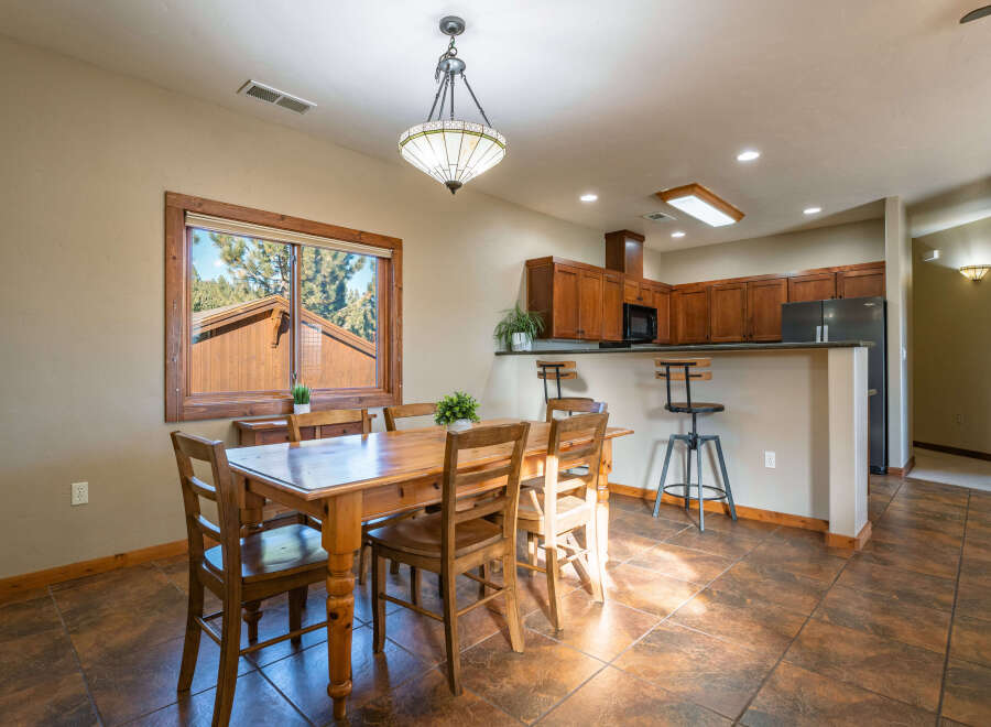 This stunning property boasts a spacious dining area, perfect for hosting gatherings.