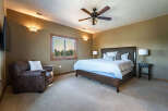This stunning bedroom boasts a luxurious king-sized bed, perfect for a restful night's sleep.