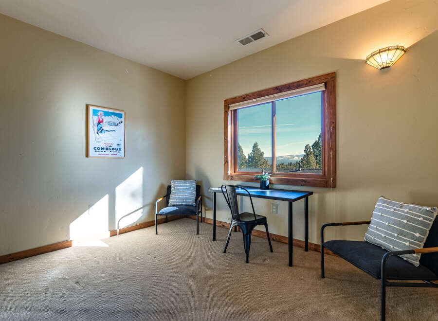 This inviting room features a cozy ambiance, perfect for relaxation or work.