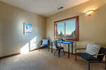 This inviting room features a cozy ambiance, perfect for relaxation or work.