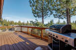Enjoy outdoor living at its finest with this stunning property featuring a spacious deck and a high-end grill.