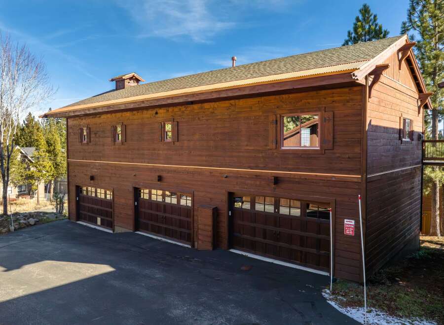 This stunning property boasts a beautiful wooden exterior, exuding rustic charm and elegance.