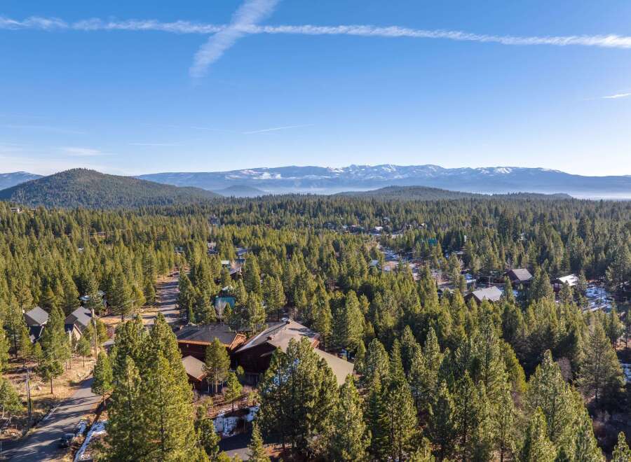 Nestled amidst a lush forest, this property offers a serene escape with stunning mountain views.