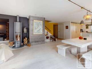 Experience the charm of this stunning property, featuring a cozy fireplace and a spacious dining area perfect for gatherings.