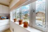 Enjoy breathtaking mountain views from this charming kitchen.