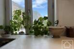 This charming property boasts a bright and airy kitchen, perfect for culinary enthusiasts.