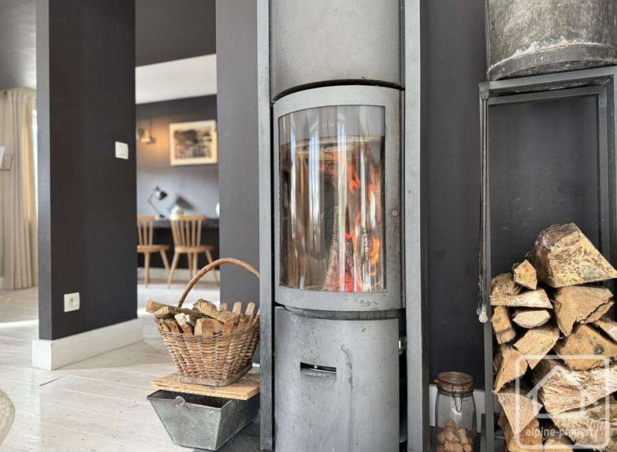 Cozy up in this inviting living space featuring a modern fireplace, perfect for those chilly evenings.