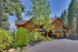 Nestled amidst lush greenery and towering trees, this stunning property offers a serene escape.
