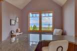 Enjoy breathtaking views from this stunning property! This home features a beautiful kitchen with a granite countertop and a cozy seating area.