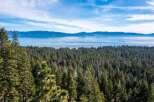 Enjoy breathtaking views from this stunning property! This home offers a serene escape with panoramic vistas of the lake and surrounding mountains.