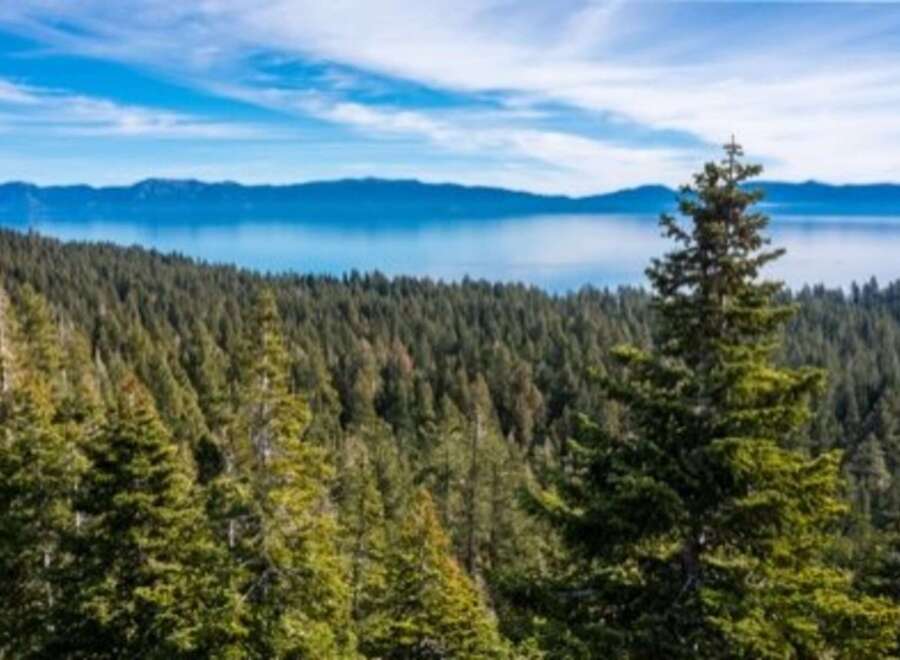 Enjoy breathtaking views from this stunning property! This home offers a serene escape with panoramic vistas of the lake and surrounding mountains.