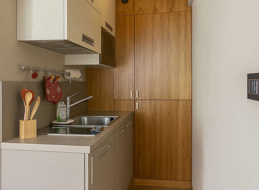 Discover this charming kitchen space, perfect for maximizing functionality in a compact area.