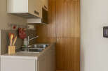 Discover this charming kitchen space, perfect for maximizing functionality in a compact area.