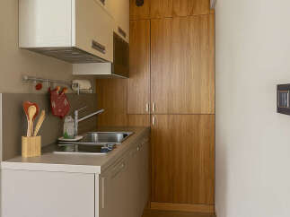 Discover this charming kitchen space, perfect for maximizing functionality in a compact area.