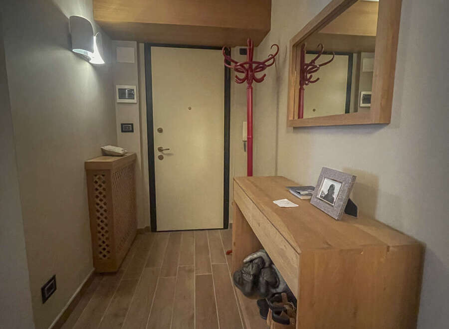 Step into this inviting entryway, showcasing a blend of modern and rustic design.