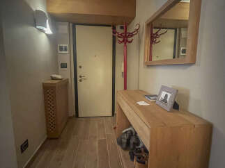 Step into this inviting entryway, showcasing a blend of modern and rustic design.