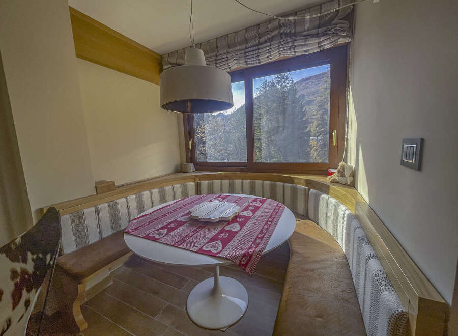 This charming dining nook offers a cozy and inviting space for enjoying meals.