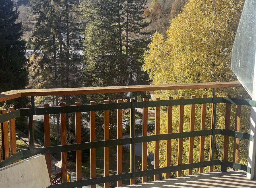 Enjoy breathtaking mountain views from this charming balcony.