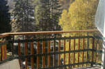 Enjoy breathtaking mountain views from this charming balcony.