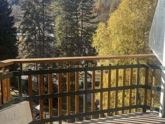 Enjoy breathtaking mountain views from this charming balcony.
