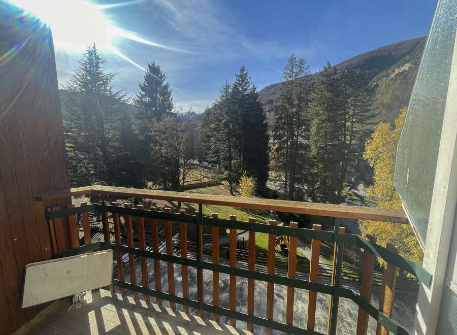 Enjoy breathtaking mountain views from this charming balcony.