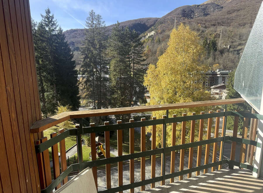 Enjoy breathtaking mountain views from this charming balcony.