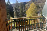 Enjoy breathtaking mountain views from this charming balcony.