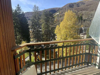 Enjoy breathtaking mountain views from this charming balcony.