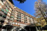 Discover the charm of this multi-story building, featuring a unique architectural design and spacious balconies.
