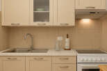 This charming kitchen boasts a modern design with ample storage and functionality.