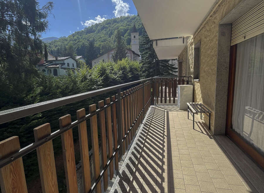 Enjoy breathtaking mountain views from this charming balcony.