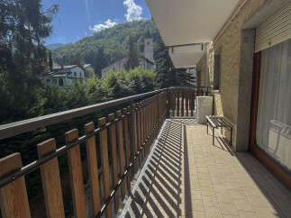 Enjoy breathtaking mountain views from this charming balcony.