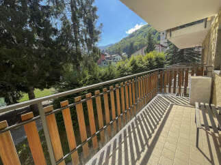 Enjoy breathtaking mountain views from this charming balcony.